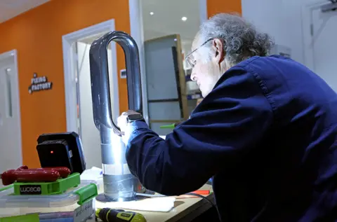 BBC Tony repairs a bladeless fan at the Fixing Factory in Camden, London