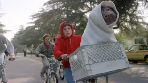 Getty Images Elliott and E.T. on a bike in the 1982 blockbuster film