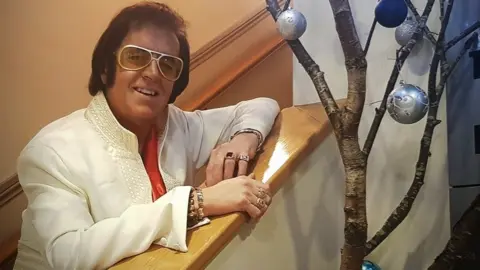 Wynne Roberts Wynne Roberts dressed as Elvis