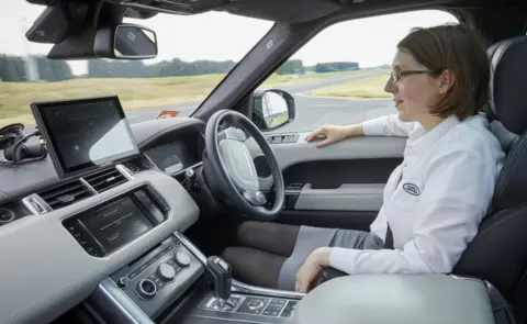 Jaguar Land Rover Dr Amy Rimmer sits in a Jaguar Land Rover autonomous car