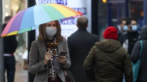 PA Media Shoppers seen in Reading, Berkshire, on Friday 18 December 2020