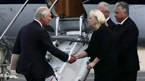 Reuters King Charles greets airport staff at Aberdeen airport