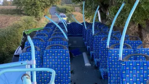 A top of a bus without a roof