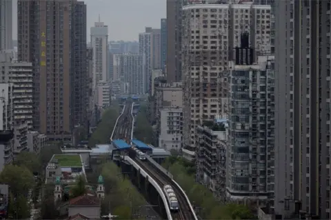 AFP A general shot shot shows buildings in Wuhan, in China's central Hubei province on 28 March 2020.