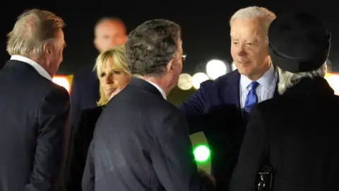 Reuters US President Joe Biden and First Lady Jill Biden arrive into Stansted airport to attend the Queen's funeral