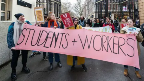 Getty Images Higher and further education staff and students take part in a protest march at University College London (UCL) campus in support of university staff strikes on 27 November, 2019