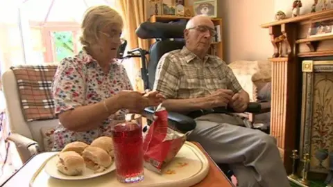 Brenda and Hugh Griffiths sit together