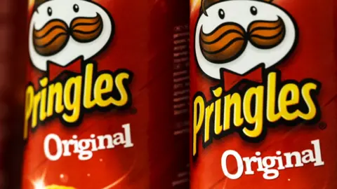Getty Images A stock image shows a close-up of two tins of original flavour Pringles crisps.