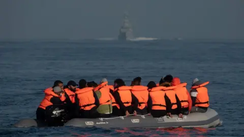 Getty Images The Border Force arrive to collect occupants in a small boat crossing the English Channel