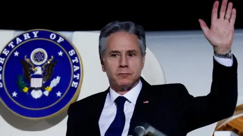 Reuters Antony Blinken gestures as he arrives in Abu Dhabi