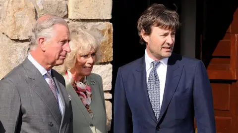 Getty/Clodagh Kilcoyne SLIGO, IRELAND - MAY 20: Charles, the Prince of Wales, Camilla, the Duchess of Cornwall with Timothy Knatchbull visit the scene in Mullaghmore where his Great Uncle, Lord Mountbatten and Timothy's twin brother died in a Provisional IRA bombing on a boat off it's coast in 1979 killing him and 3 others. The Prince and Duchess also meet members of the local community that were involved in the rescue operation during the second day of their Royal visit on May 20, 2015 in Sligo, Ireland. The Prince of Wales and Duchess of Cornwall arrived in Ireland today for their four day visit to the Republic and Northern Ireland, the visit has been described by the British Embassy as another important step in promoting peace and reconciliation. (Photo by Clodagh Kilcoyne/Getty Images)