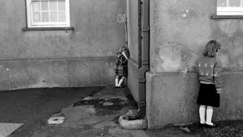 Malcolm Glover Children at play in a school playground in Botwnnog