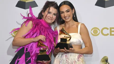 Getty Images Abigail Barlow and Emily Bear pose with their Grammy trophies