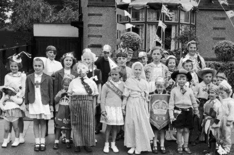 Mirrorpix Children in fancy dress for a 1953 Coronation party in Arlon Avenue, Nuneaton