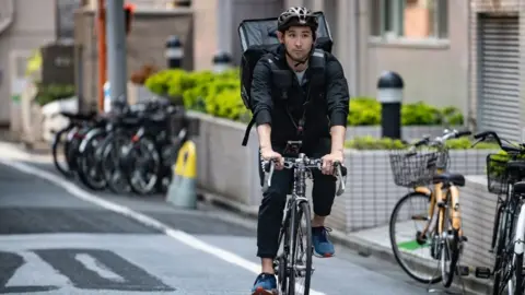 Getty Images With the Olympics postponed, top Japanese fencer Ryo Miyake has swapped his mask and foil for a bike and backpack as a Tokyo UberEats delivery rider