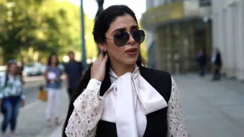 Getty Images Emma Coronel Aispuro, wife of accused Mexican drug lord Joaquin "El Chapo" Guzman, leaves after a pre-trial hearing at Brooklyn Federal Courthouse in the Brooklyn borough of New York, on August 14, 2018.