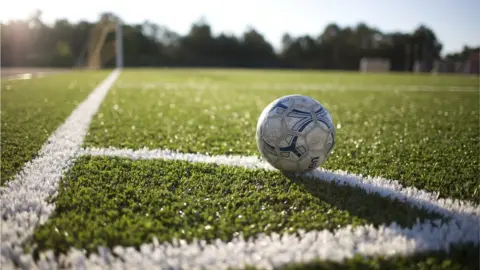 Getty Images Football on corner quadrant of pitch