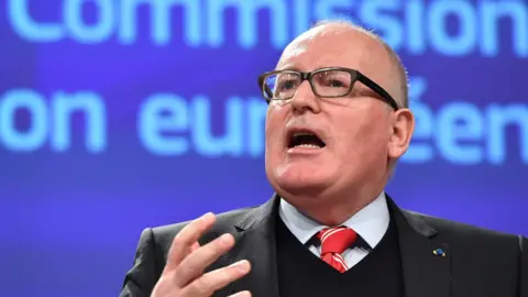 AFP European Commission Vice-President Frans Timmermans announces measures against Poland