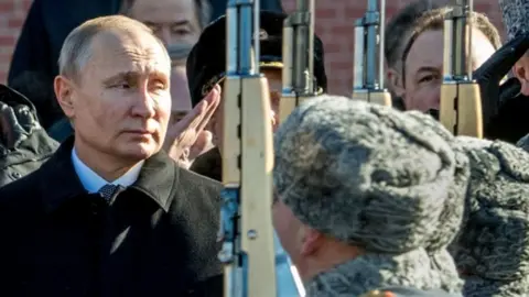 Getty Images Russian President Vladimir Putin watches military parade in Moscow. File photo