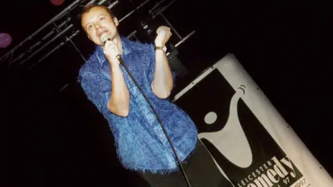 Big Difference Company A picture of Graham Norton performing at the Leicester Comedy Festival in 1997
