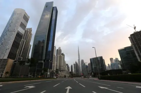 Reuters File photo of empty road in Dubai's Business Bay area (28 March 2020)