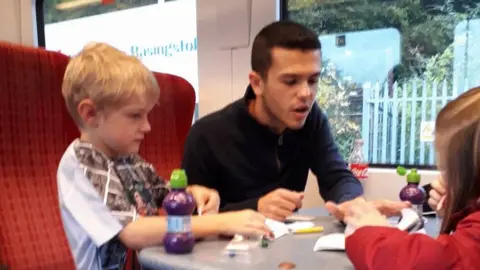 Gayna Pealling Dan Ball playing with kids