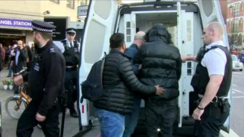 Police officers engaged in stop and search