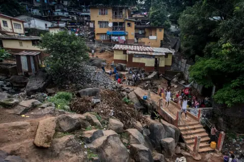 Olivia Acland People watch the group going through their routine