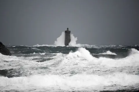 Getty Images Waves crashing on the "Phare du Four" (Four's lighthouse) in Porspoder, western France, on November 2, 202