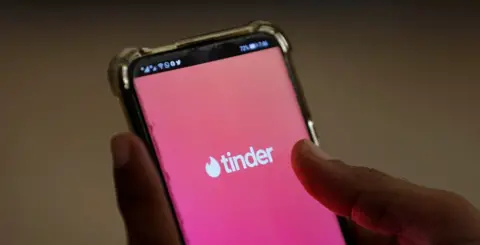 Reuters Tinder on a smartphone