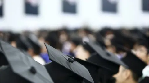 Thinkstock Students in caps and gowns