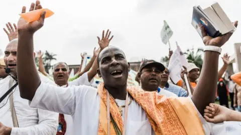 AFP Hindu devotees take part in a 'Peace March' through the township of Chatsworth outside the city of Durban on September 2, 2018. - Devotees celebrate the festival by participating in processions,dressing up their children like characters from the story of Lord Krishna's life, and watching or staging re-enactments of plays from Hindu mythology