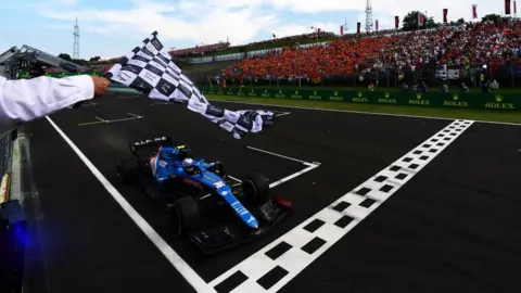 Getty Images Esteban Ocon winning the Hungarian Grand Prix