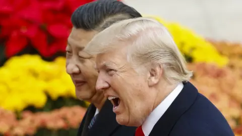 Getty Images US President Donald Trump has urged China to change its "unfair practices, and give fair and reciprocal treatment to American companies".