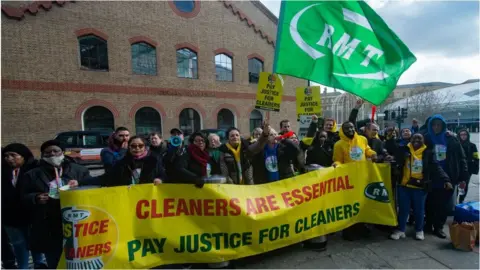 Getty Images Striking cleaners at St Pancras on 12 March 2022