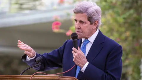 EPA Special US envoy on climate John Kerry speaks at a joint news conference with Bangladesh Foreign Minister Dr AK Abdul Momen in Dhaka, Bangladesh, 09 April 2021