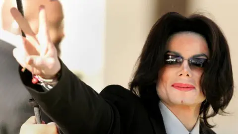 Getty Images Singer Michael Jackson walks into the Santa Maria Superior Court on the fifth day of his child molestation trial on 7 March, 2005 in Santa Maria, California