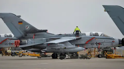 Reuters A technician works on a German Tornado jet at Incirlik airbase, Turkey, January 21, 2016