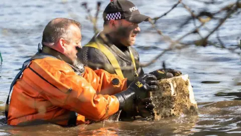 National Trust Divers recover bridge stone