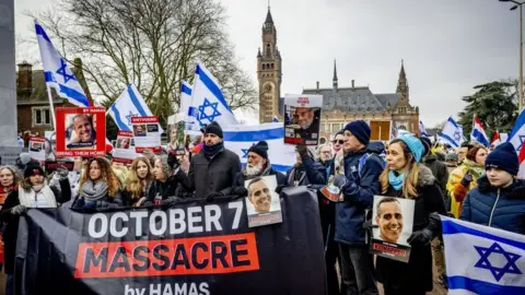 Getty Images Pro-Israelis take part in a demonstration during a hearing at the International Court of Justice (ICJ)