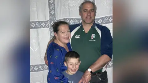 family photo Anne, Damian and their son Joseph