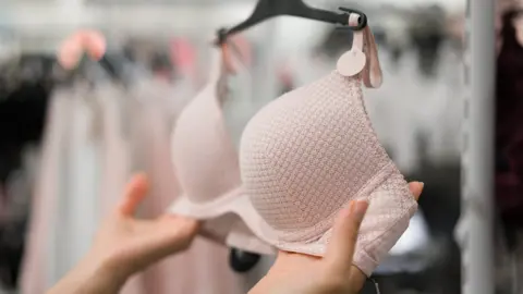 Getty Images Woman in underwear shop