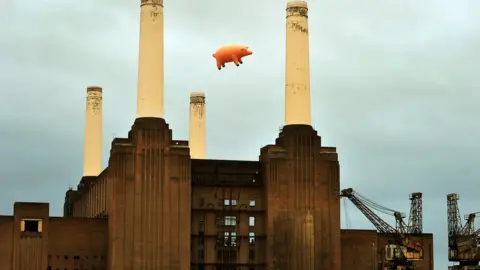 John Stillwell Inflatable pig balloon over power station