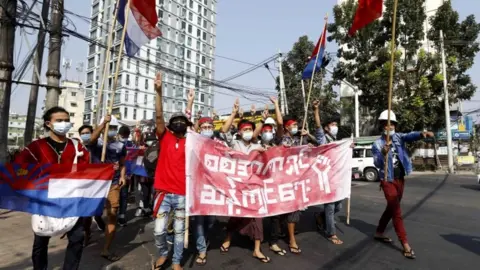 EPA Protesters flash the three-finger salute in Yangon, Myanmar
