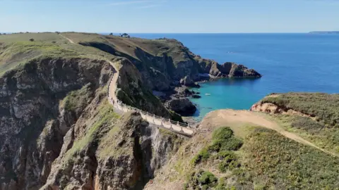 Drone shot of La Coupee, Sark on a sunny day