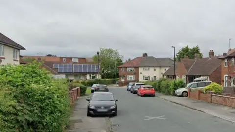 Google A street view image of the road shows a number of cars parked outside residential properties.