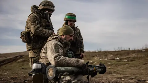 Getty Images Ukrainian soldiers practice with the AT4 anti-tank launcher during firing training on March 6 in Donestk