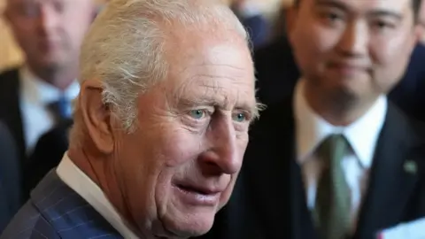 A close-up of the the King at a reception