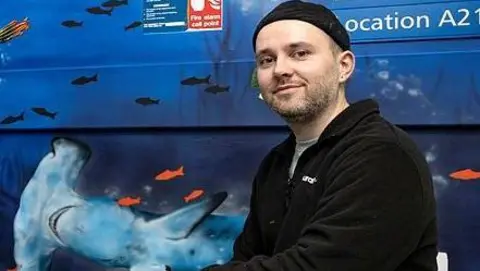 The Royal Wolverhampton NHS Trust A man sat in front of a mural