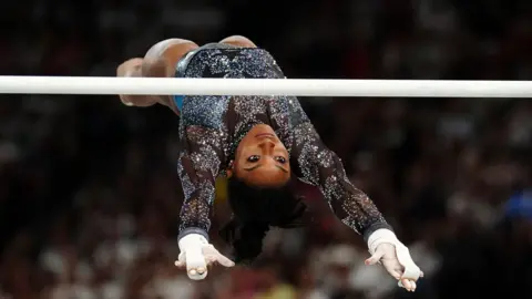 PA USA's Simone Biles performs on the Uneven Bars during the Artistic Gymnastics, women's qualification